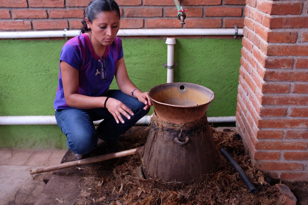 Graciella explaining the fine points of clay pot distillation